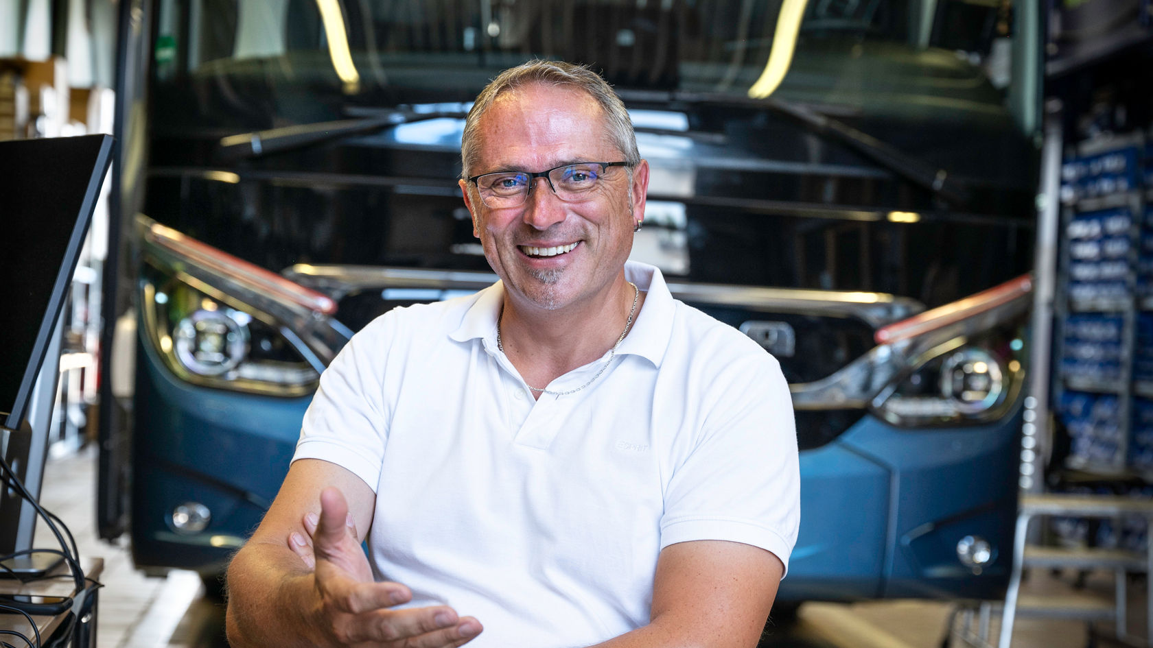 A first-class seat with a steering wheel.