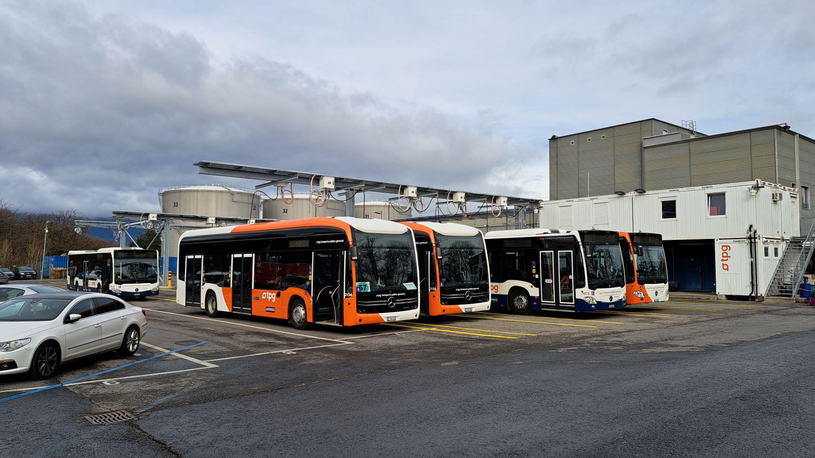 Several Mercedes-Benz eCitaro electric buses are parked at the charging infrastructure in the depot